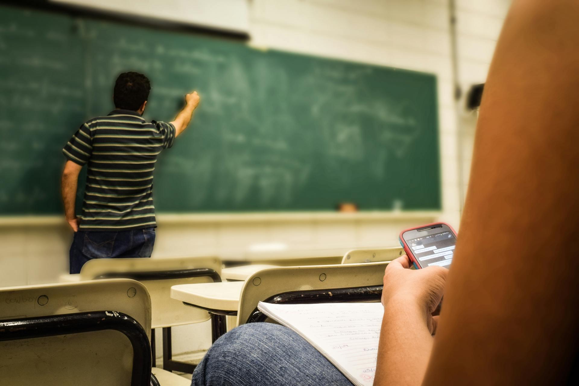 teacher writing on board